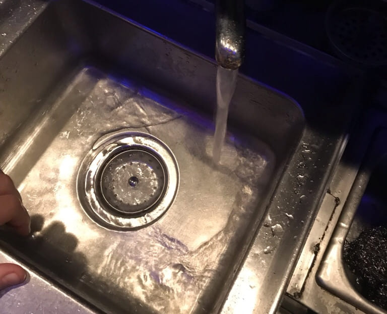 unclog a drain for smooth flowing water in the kitchen sink